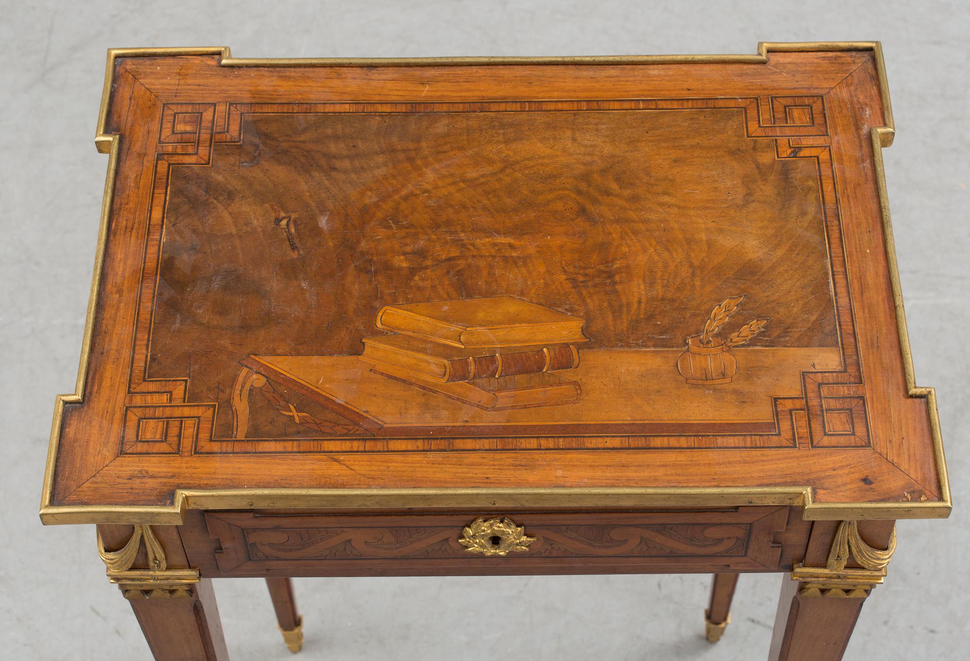A Louis XVI-style circa 1900 occasional table.