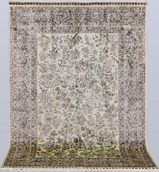 An Oriental silk rug, approx. 124 x 183 cm.