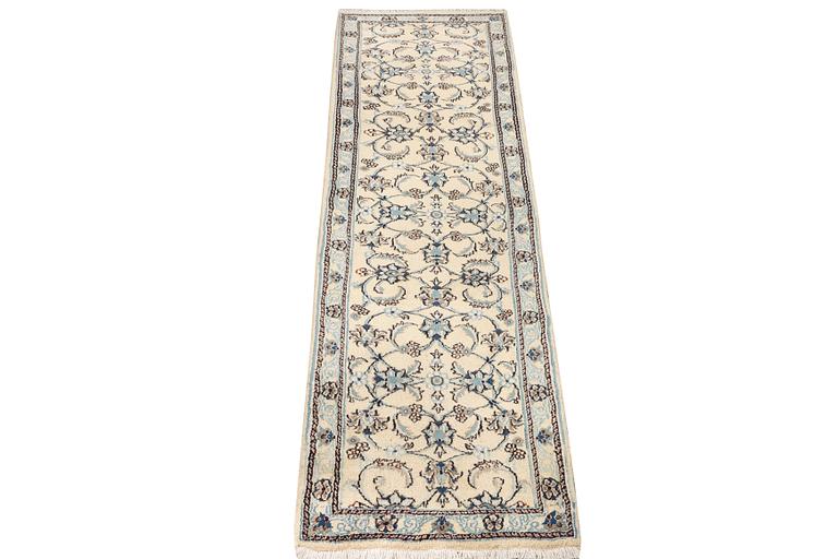 A Nain runner, part silk, c. 288 x 64 cm.