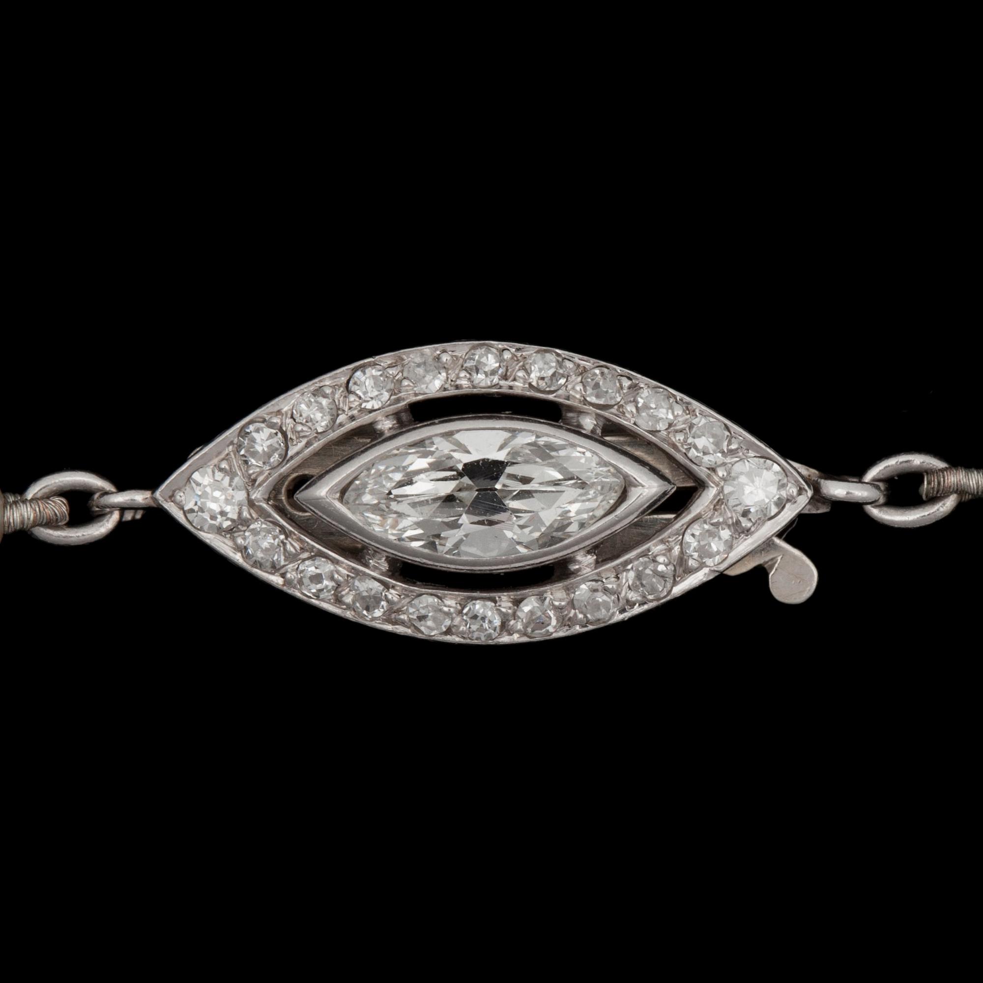 A oriental pearl, 7.4-3mm in diameter, necklace. Clasp set with marquise- and brilliant-cut diamonds app. tot. 0.70ct.