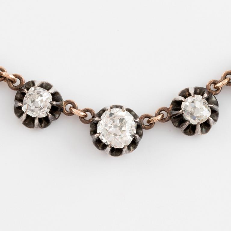 A gold and silver necklace set with old- and rose-cut diamonds.