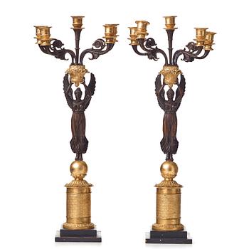 124. A pair of Empire early 19th century five-light candelabra by Pierre Chibout.
