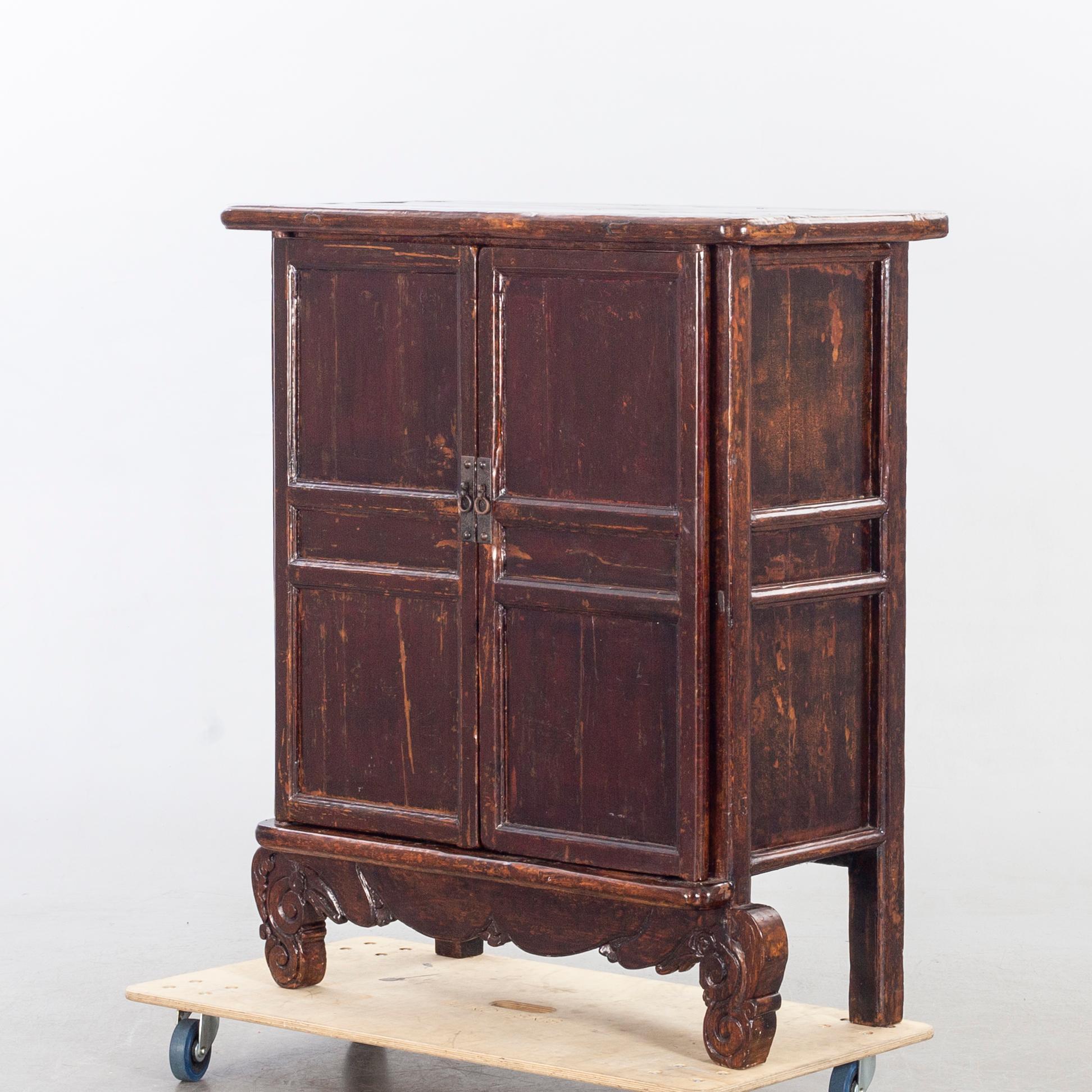 A 19TH CENTURY CHINESE CUPBOARD.