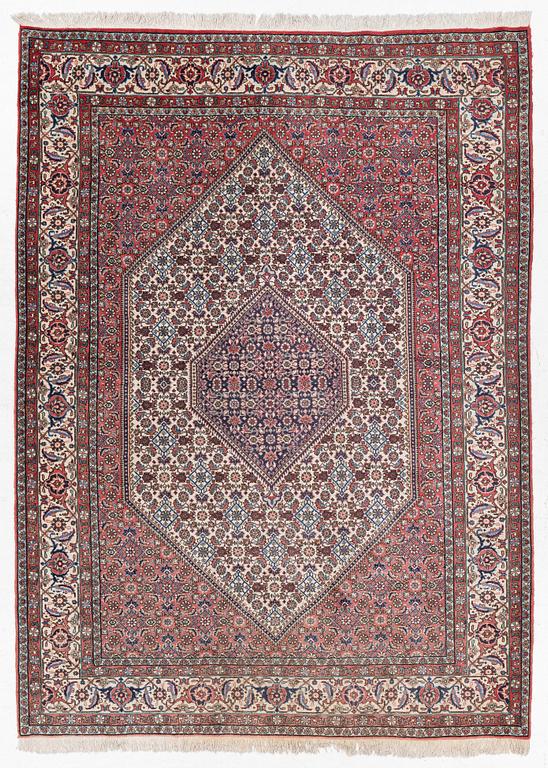 An oriental rug, approx. 238 x 174 cm.