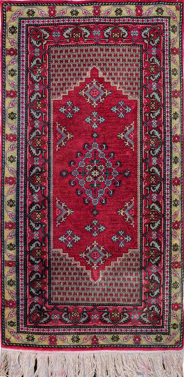 A rug, Oriental silk, ca 141 x 70 cm.