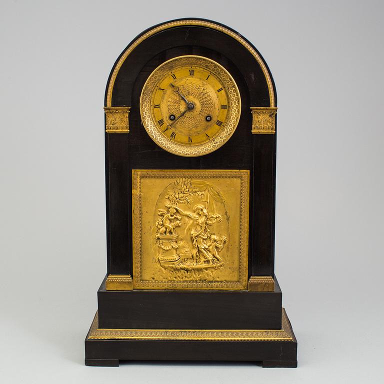An enpire mantle clock, first half oc the 19th Century.
