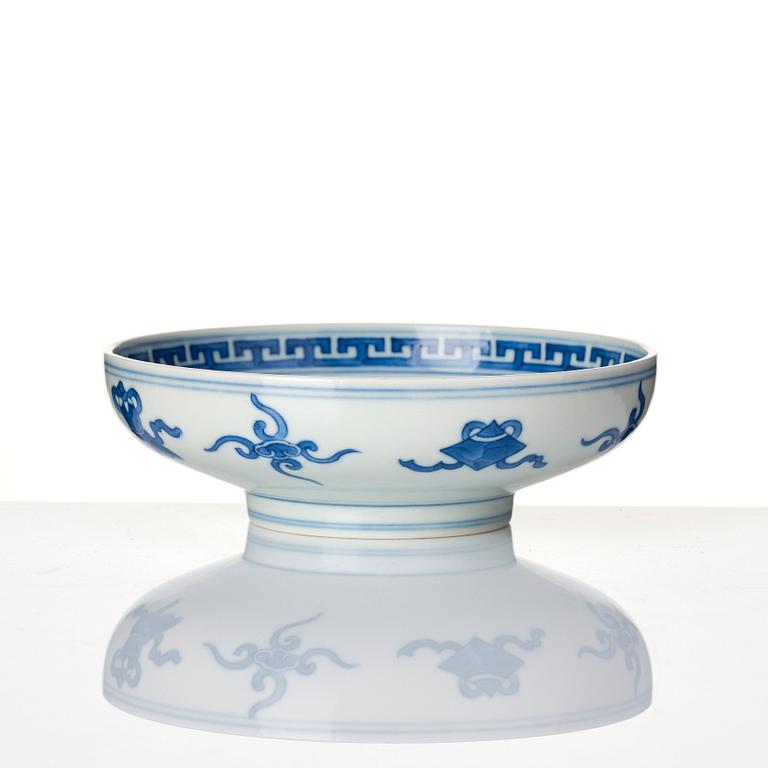 A blue and white heavily potted dish, Republic period with a mark.