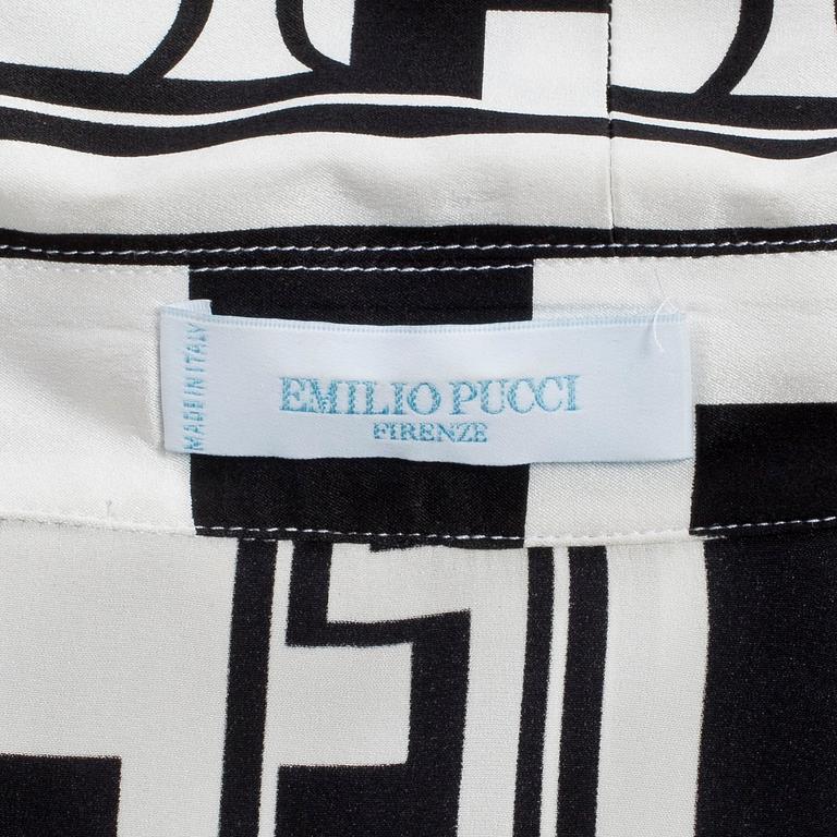EMILIO PUCCI, a silk shirt with belt.