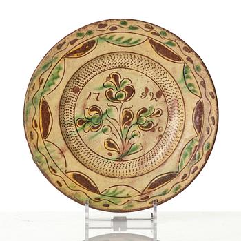 An earthenware dish, dated 1792.