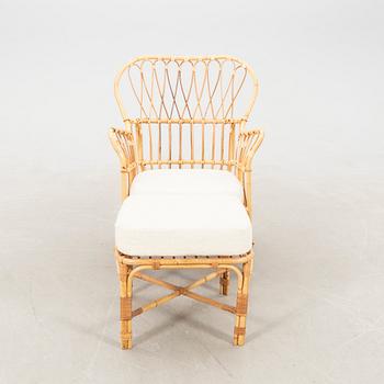Josef Frank, wicker chair with stool model no. B 311 for Svenskt Tenn, second half of the 20th century.