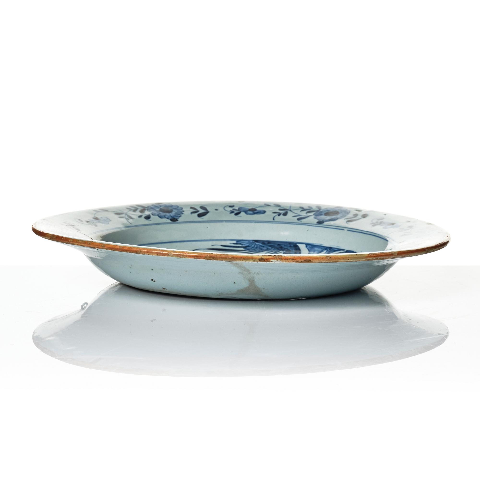 A group of three faience dishes, 18th century.