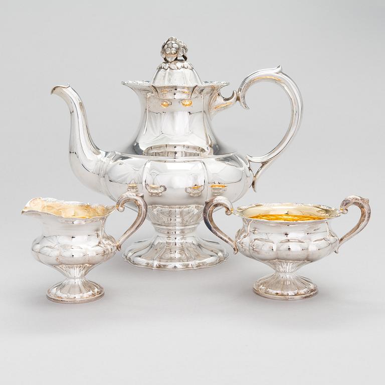 A silver coffee pot, a parcel-gilt sugar bowl and cream jug, Turku Finland 1946 and 1985.
