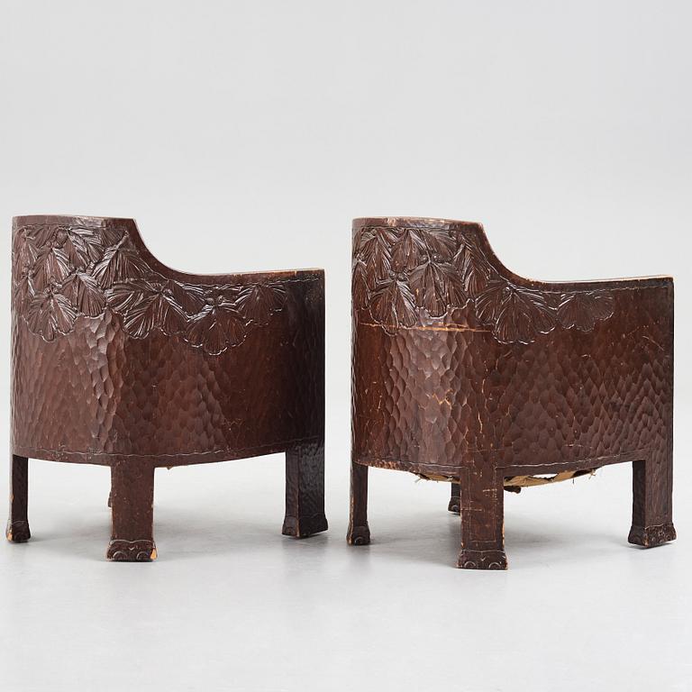 Otto Wretling, attributed to, a pair of Art Nouveau carved pine easy chairs,