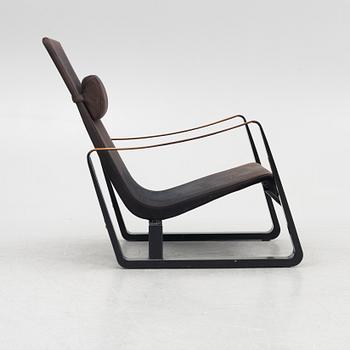 Jean Prouvé, a 'Cité' easy chair, Vitra, 2012.