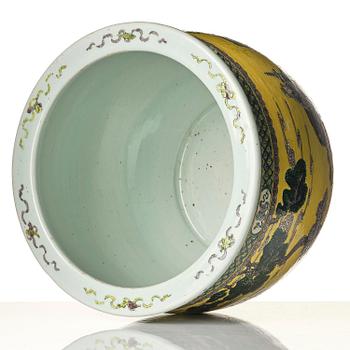 A large yellow ground famille verte bisquit jardiniere, Qing dynasty, 19th century. Marked 'Tack Loong Canton China'.