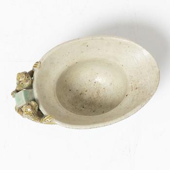 A famille verte bisquit wine cup, Qing dynasty, Kangxi (1662-1722).