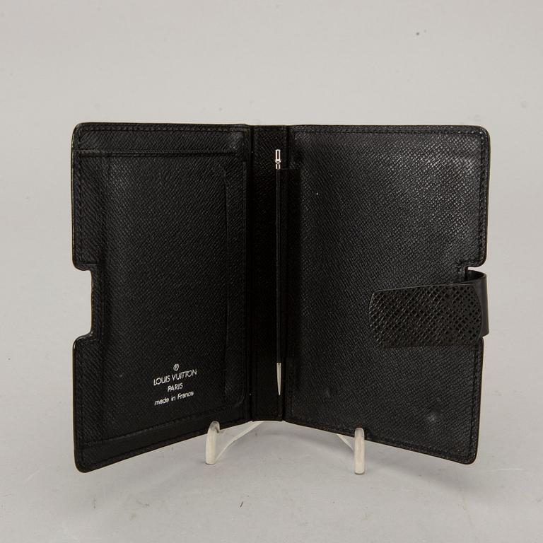 A Louis Vuitton palm pilot leather cover.