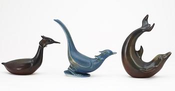 Three Gunnar Nylund stoneware figures, a dolphin, a pheasant and a great crested grebe, Rörstrand.