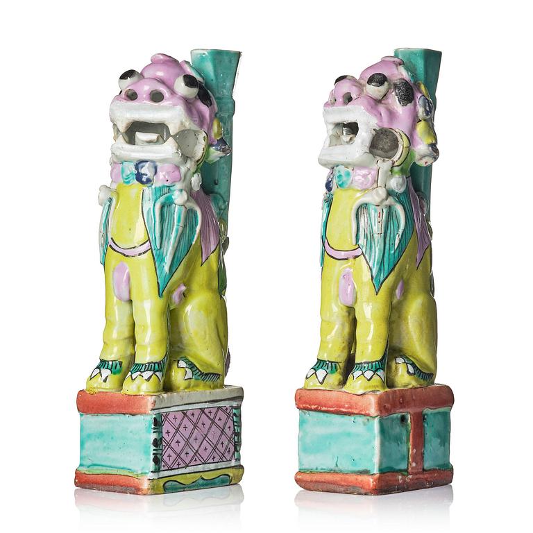 A pair of famille rose 'buddhist lion' joss stick holders, Qing dynasty, circa 1800.