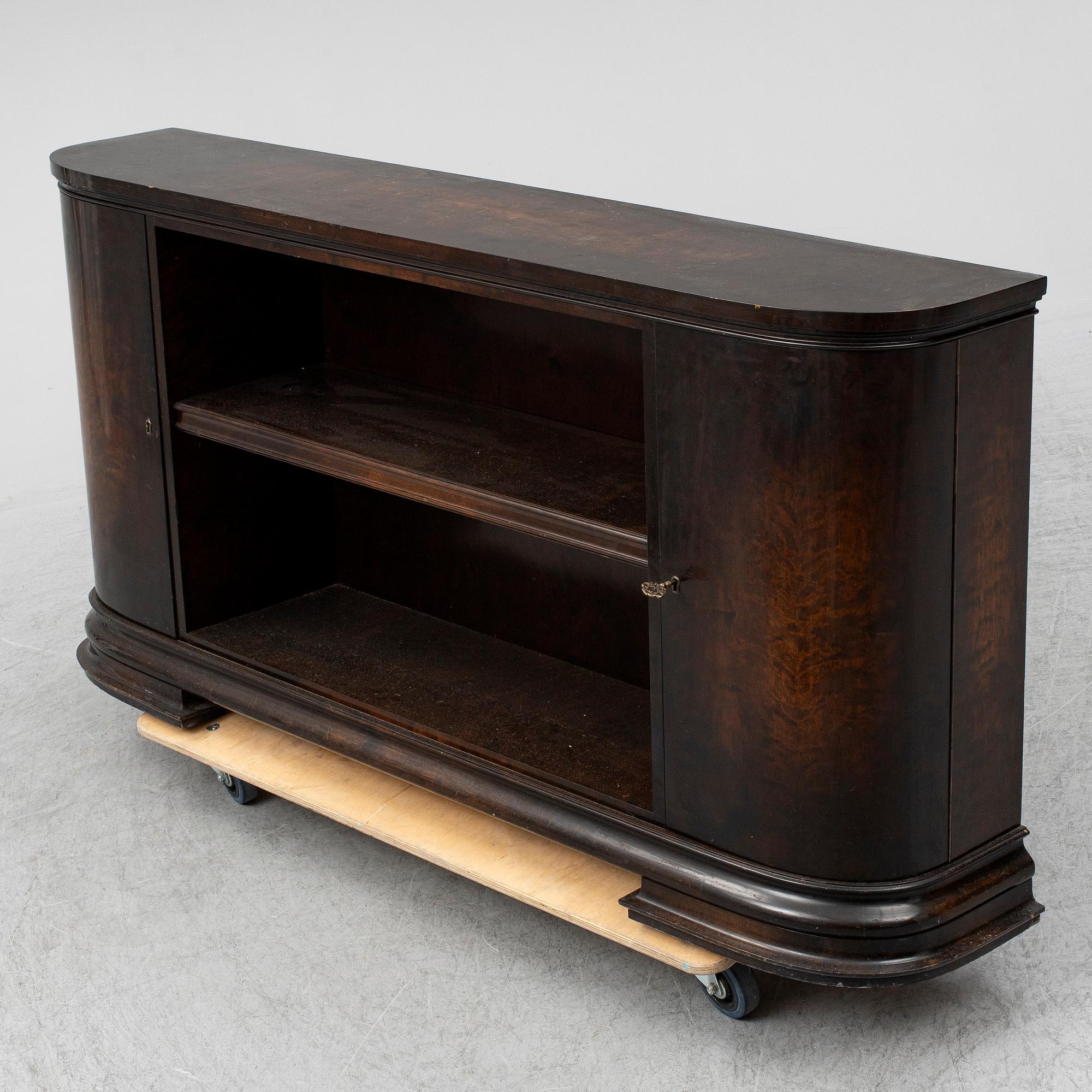 A 1930s stained birch shelf.