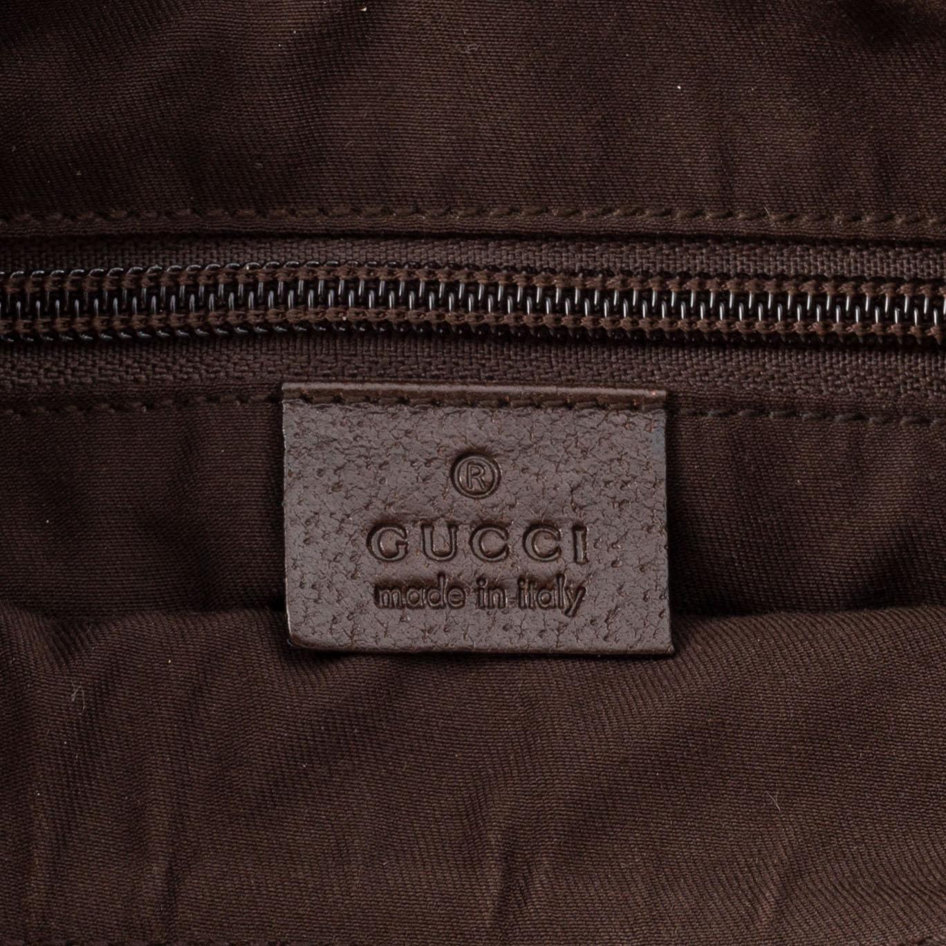 Gucci, a monogram canvas messenger bag.