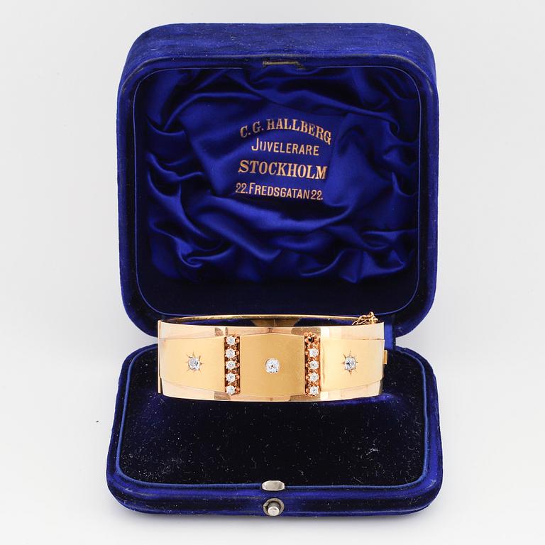 An 18K gold bracelet set with old-cut diamonds.