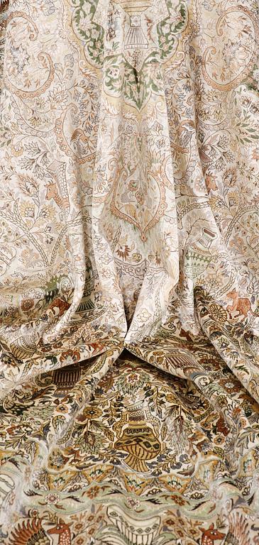 An oval pictoral silk carpet, ca 273 x 180 cm.