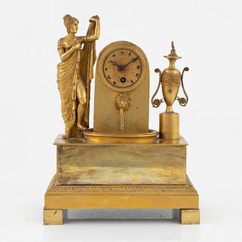 An ormolu Empire mantel clock, first part of the 19th century.