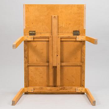 Alvar Aalto, a mid 20th century 'DL85' folding table, seven chairs for Artek.