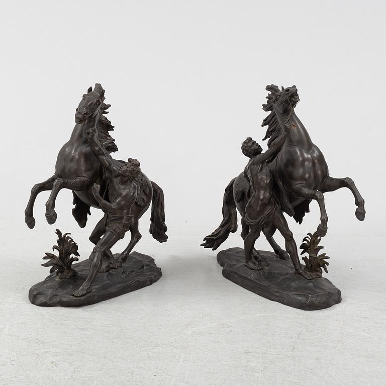 Guilliaume Coustou, after, a pair of bronze sculptures.