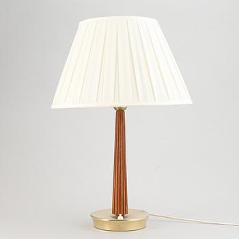 A brass and oak table light by Hans Bergström for ASEA, mid 20th Century.