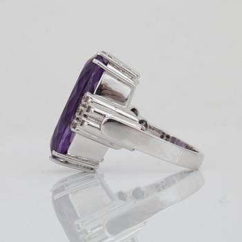 An amethyst, circa 19 cts, and diamond ring.