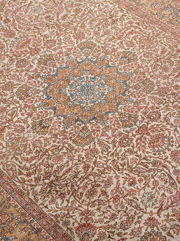 A carpet, an old silk Turkey, ca 237,5 x 146,5  cm (as well as 3,5-4 cm flat weave at the ends).