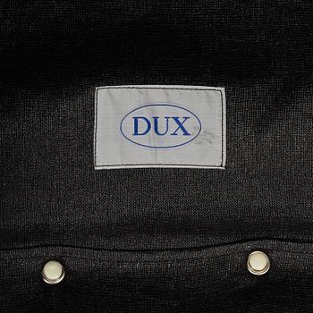 A pair of leather upholstered easy chairs from Dux, late 20th Century.