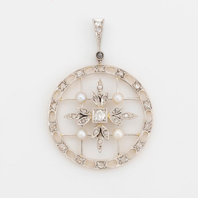 A platinum and gold pendant set with old- and rose-cut diamonds and pearls.