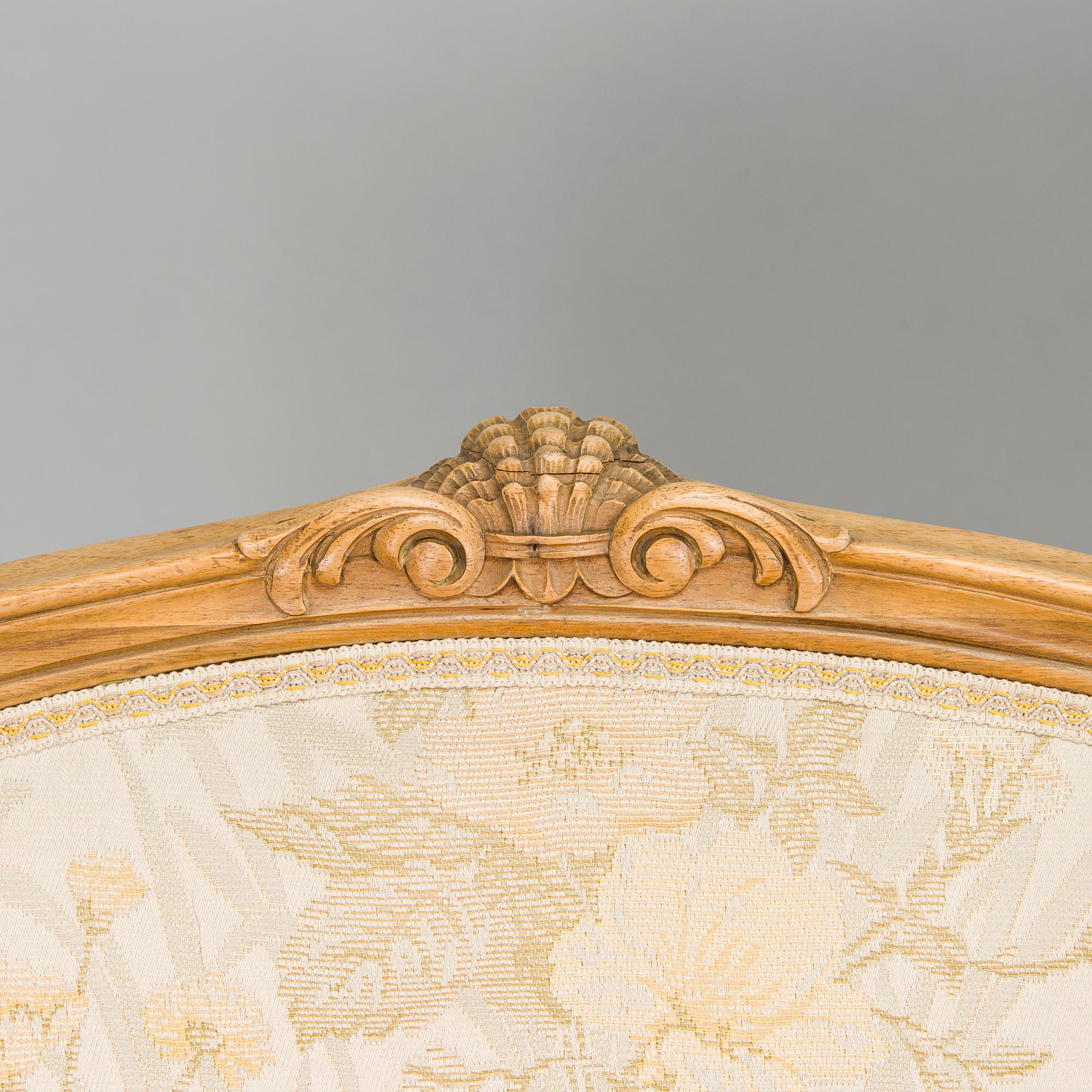 A pair of mid-20th-century French armchairs in Roccoco style.