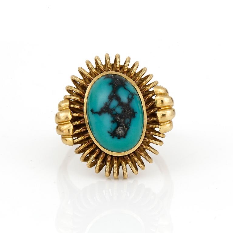 RING, med cabochonslipad turkos.