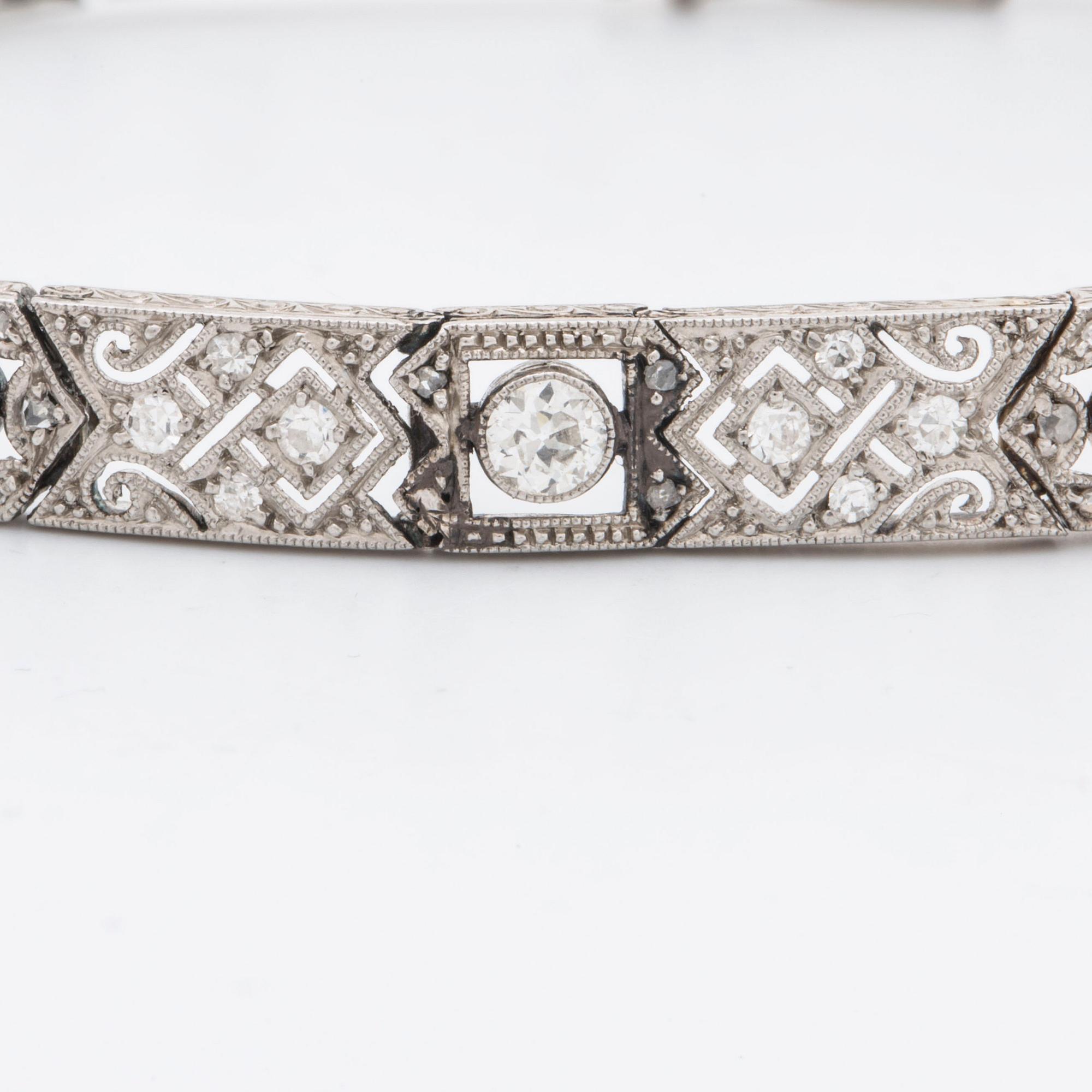 DIAMOND BRACELET, probably platinum, old and rose-cut diamonds approx 2 ct in total, 1 large stone not diamond.