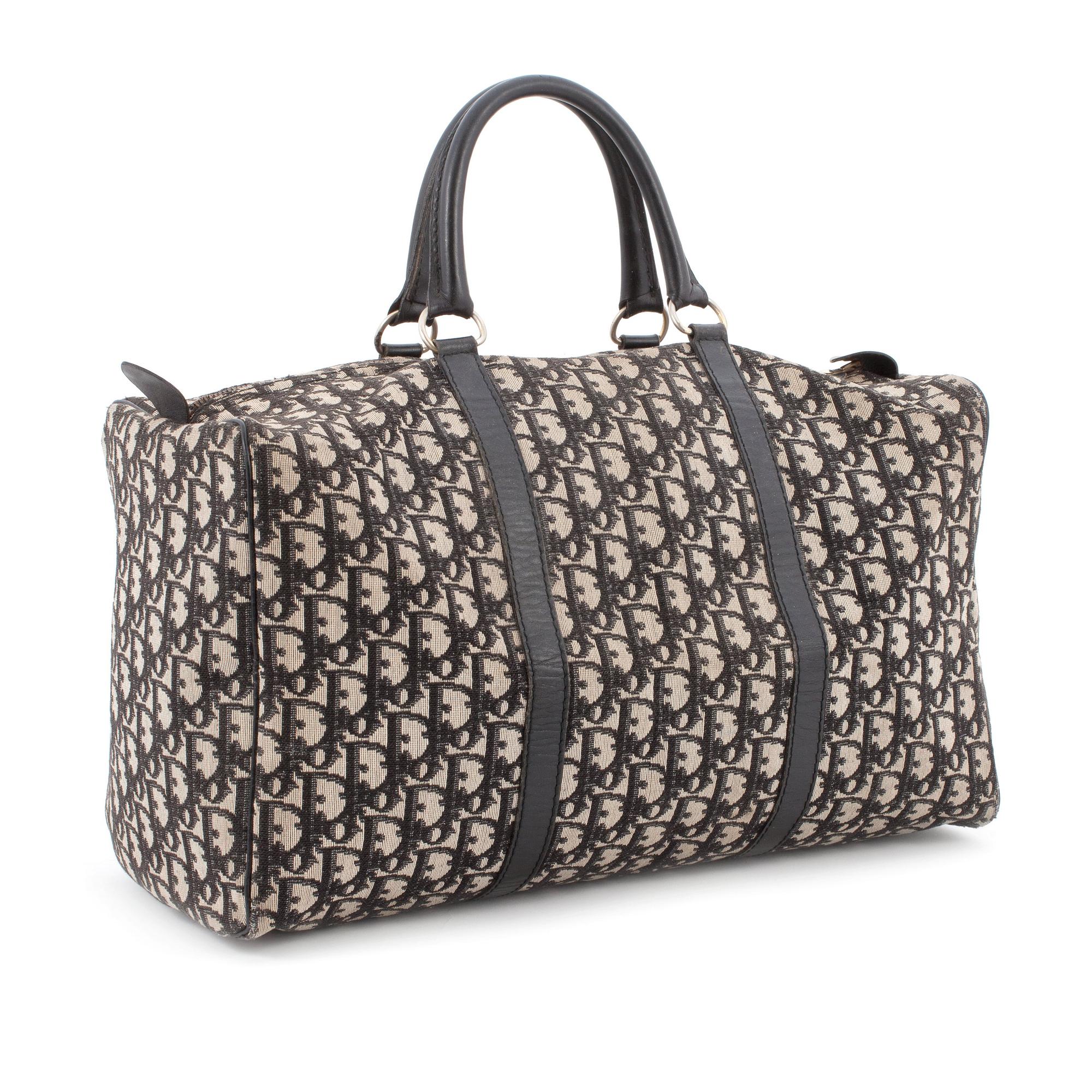 CHRISTIAN DIOR, a black monogram canvas bag.