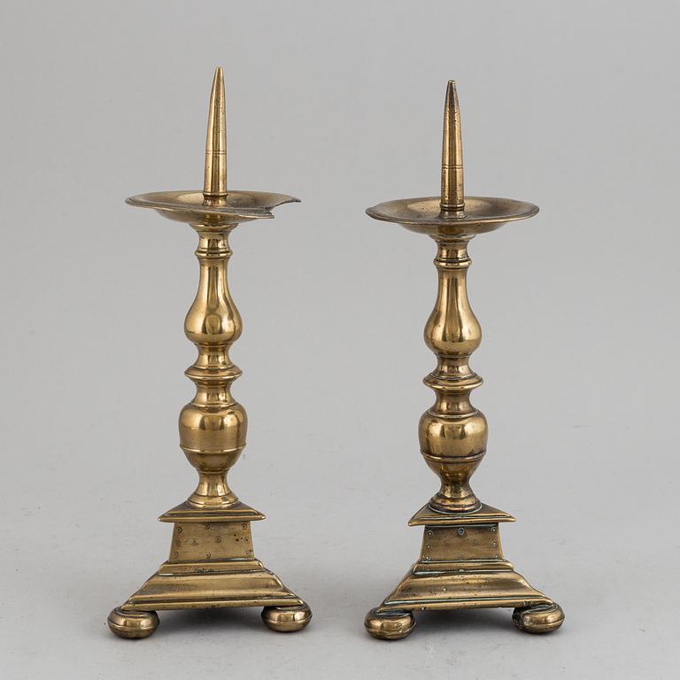 A pair of 17th century bronze candlesticks.