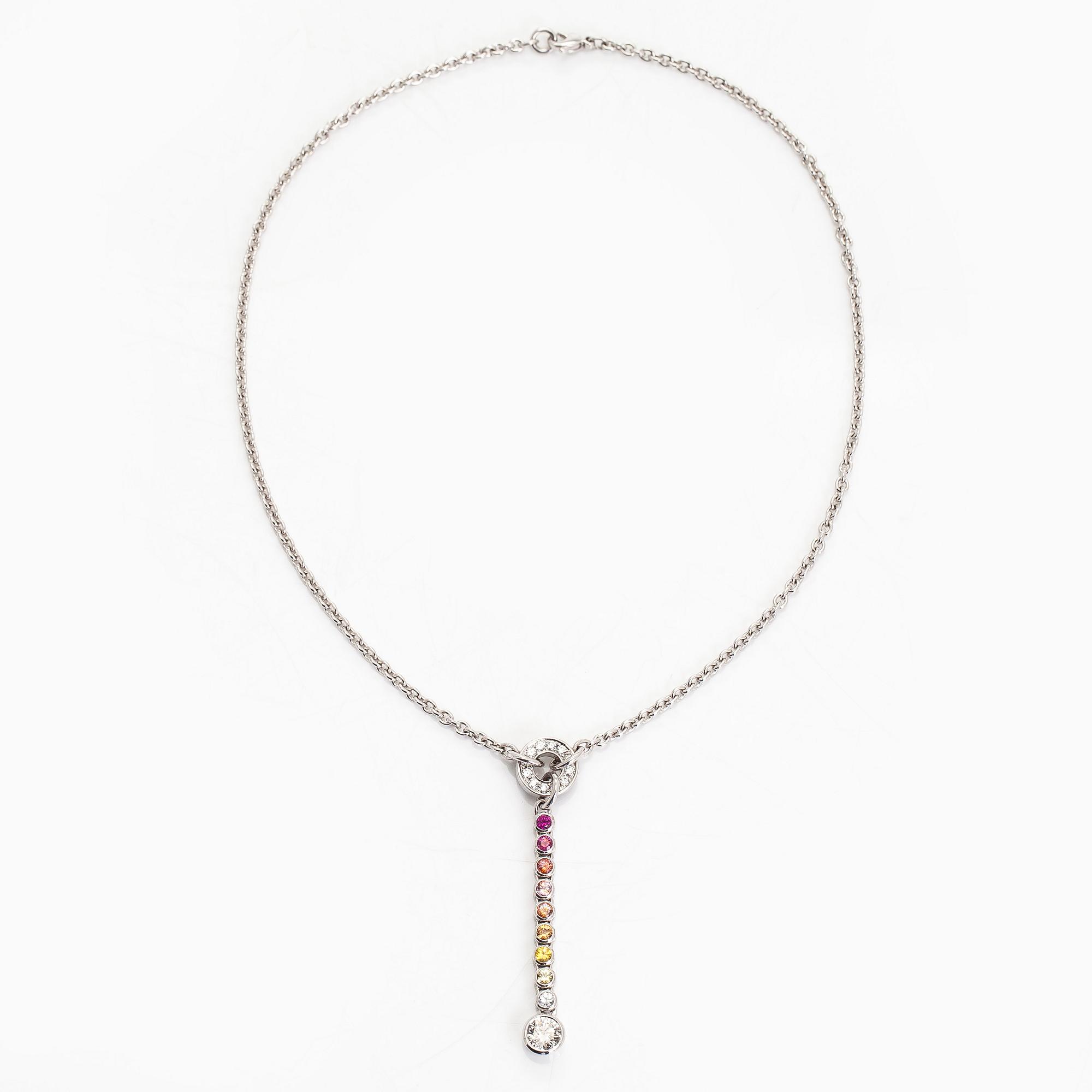 An 18K white gold necklace, set with brilliant-cut diamonds, a ruby, and sapphires. Kultaseppä Kulmala, Helsinki.