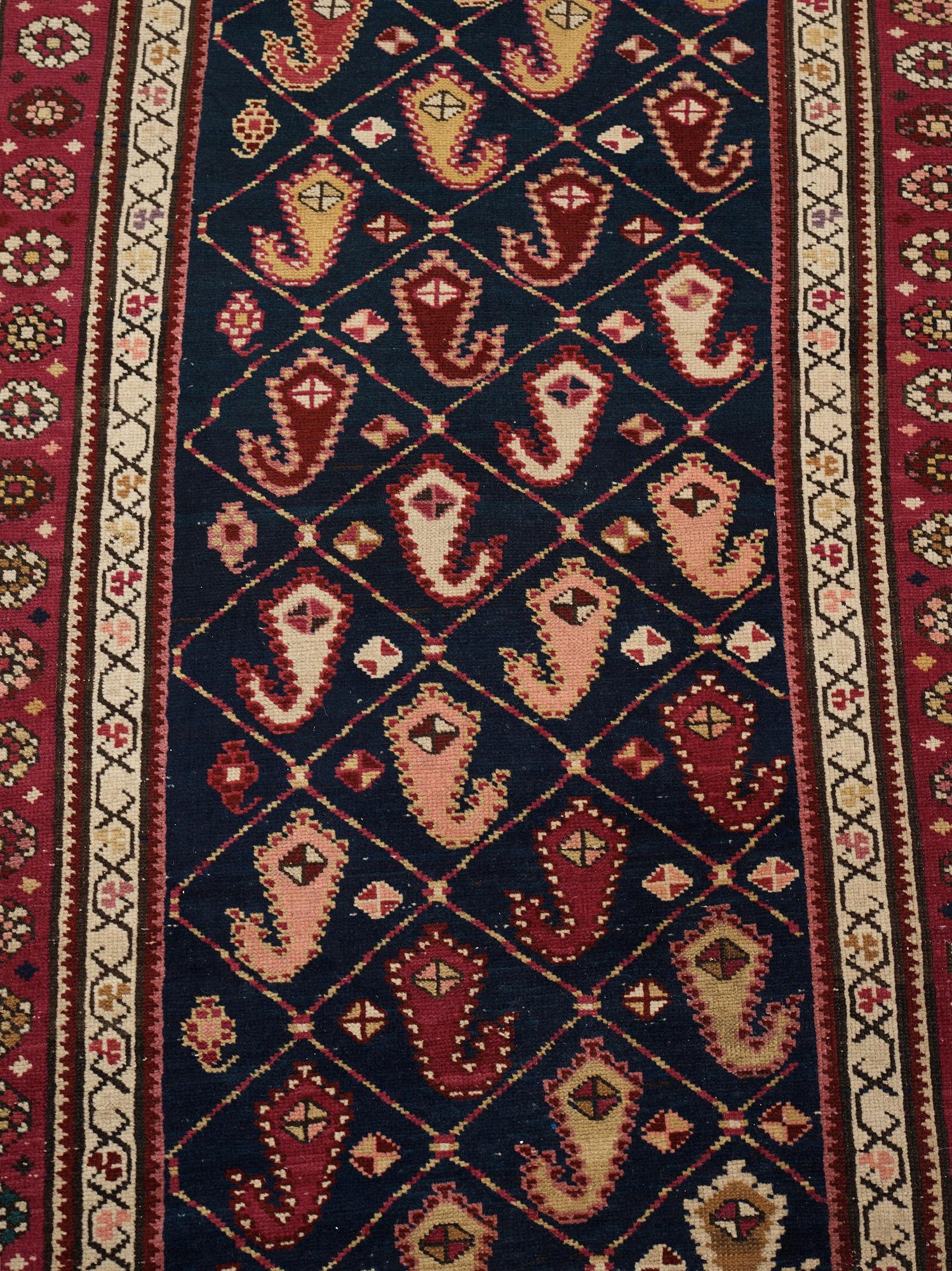 Matto, a runner, an antique Karabagh, ca 268,5-278 x 98,5-103,5 cm.