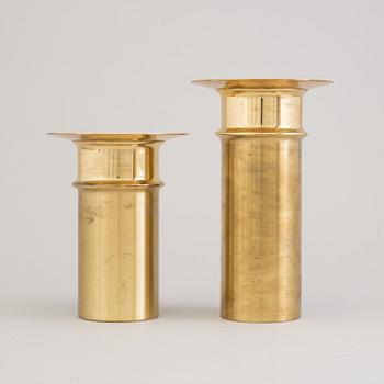 TAPIO WIRKKALA, a pair of brass candlesticks from Kultakeskus Oy, Finland.