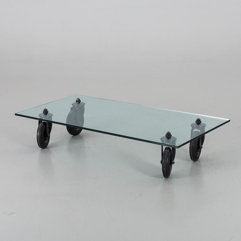 A COFFEE TABLE "Tavolo con Ruote", by Gae Aulenti, Fontana Arte, Italy.