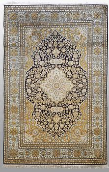 A RUG, silk Qum, around 222 x 137 cm.