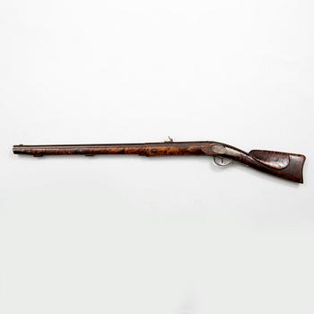 A mid 19th century percussion rifle.