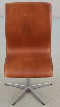 An Arne Jacobsen 'Oxford' brown leather and aluminium chair, Fritz Hansen, Denmark.