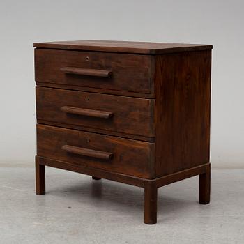 AXEL EINAR HJORTH, an attributed, stained pine chest of drawers, 1930's.