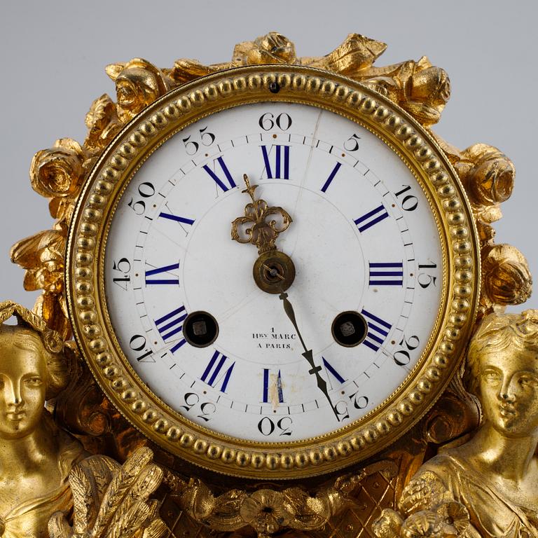 A French gilt bronze mantel clock from Henry Marc á Paris, second half of the 19th century.