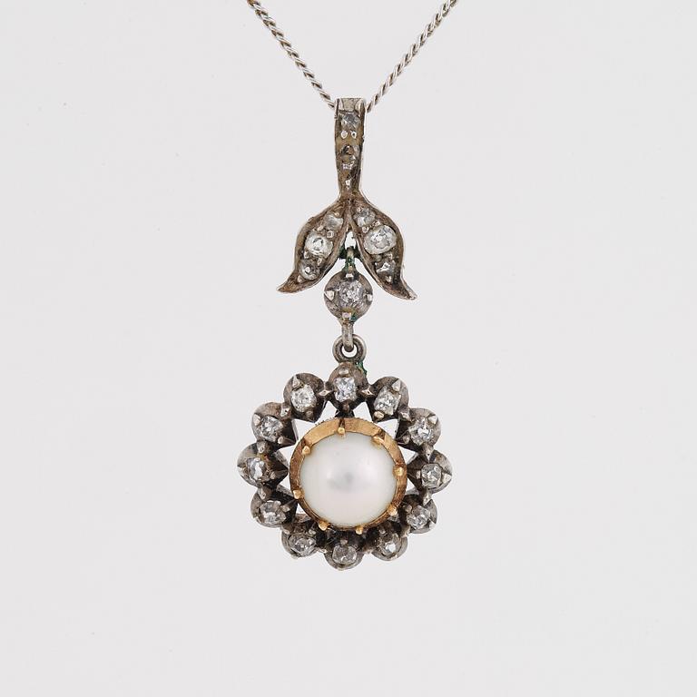 Old-cut diamond and pearl pendant.